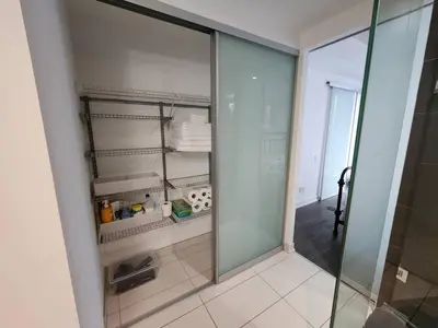 a glass walk in shower in a bathroom at Chic 1BDR Loft with Office Space-Heart of Toronto in Toronto