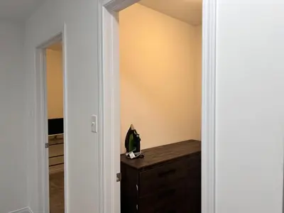 a hallway with a door leading to a bedroom at Spacious 4-Bedroom Home, Comfortably Sleeps 10 in Barrie