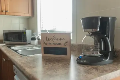 a kitchen counter with a blender and a box on it at Main Floor Luxury Apartment in Vaughan