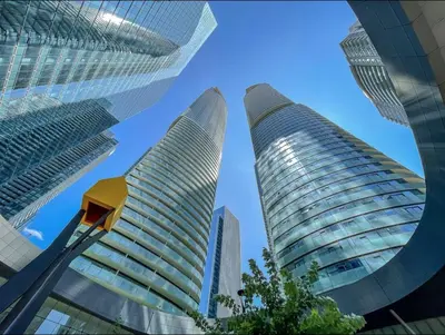 two tall buildings in a city with a blue sky at Presidential Suite Heart of Downtown with Stunning View in Toronto