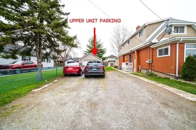 a car parked on a dirt road next to a house at 2br, Welland Canal, Near Merritt, 20 Min To Falls in Welland