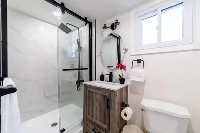 a bathroom with a shower and a toilet and a sink at 2br, Welland Canal, Near Merritt, 20 Min To Falls in Welland