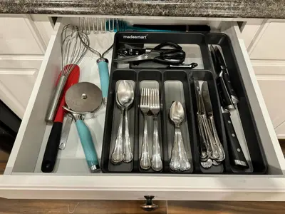 a drawer filled with utensils in a cabinet at Spacious Bottom-Floor 2BR Suite in Innisfil