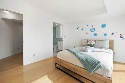 a bedroom with a bed with planets on the wall at Modern 2-Bedroom Condo w Floor to Ceiling Windows in Toronto