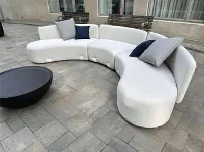 a white couch and a coffee table in a courtyard at Modern 2-Bedroom Condo w Floor to Ceiling Windows in Toronto