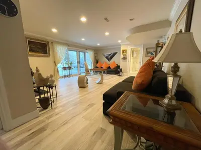 a living room with a couch and a table at Khan’s Resort in Cobourg