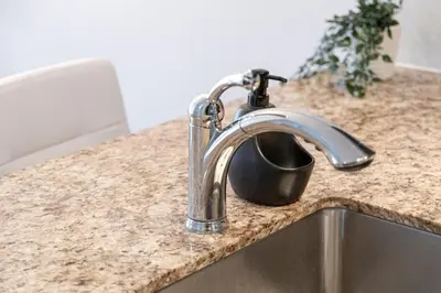 a kitchen sink with a faucet on a counter at DWTN Condo Near CN Tower! w/ Free Parking in Toronto