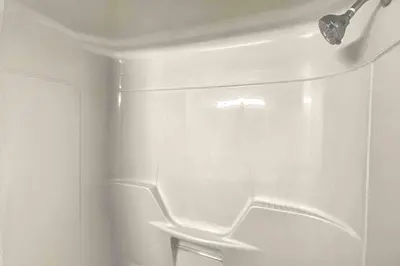 a white refrigerator with its door open in a bathroom at White House Suite - Sleeps 4 in St. Catharines
