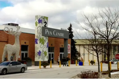 a sign for a parking lot in front of a building at White House Suite - Sleeps 4 in St. Catharines