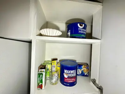 a white cabinet with some food items in it at Mountain View Suite - Sleeps 6 in St. Catharines