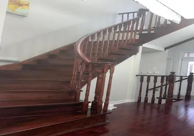a wooden staircase in a home with wooden floors at Beautiful private Room near Toronto pearson Airport in Brampton