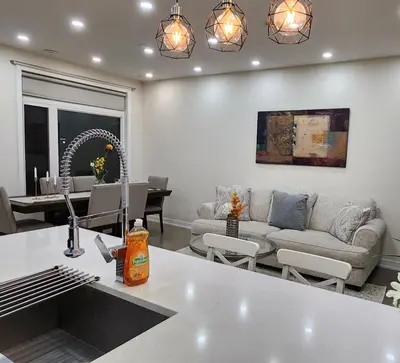 a living room with a couch and a table at Modern Luxury 3 bed rooms House in Toronto Mississauga in Mississauga