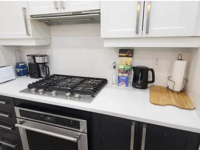 a kitchen counter top with a stove top oven at Modern Luxury 3 bed rooms House in Toronto Mississauga in Mississauga