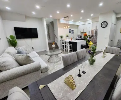 a living room with a couch and a table at Modern Luxury 3 bed rooms House in Toronto Mississauga in Mississauga