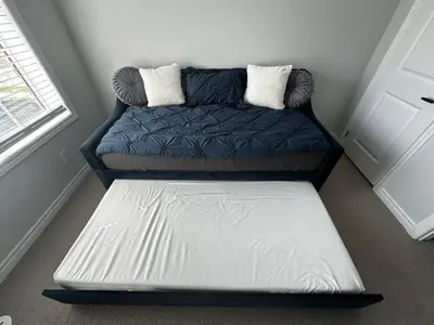 a couch with a mattress in a room at Cozy Whitby Retreat in Whitby