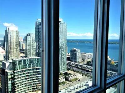 a view of a city skyline from a window at TVHR - Luxury Condos in Heart of Downtown with Breakfast in Toronto