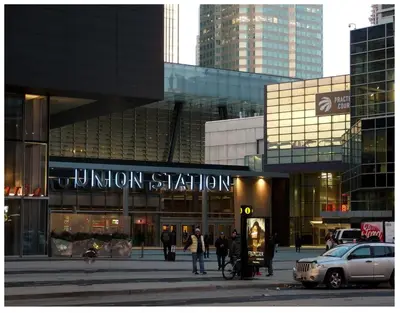 a building in a city with people walking in front of it at TVHR - Luxury Condos in Heart of Downtown with Breakfast in Toronto