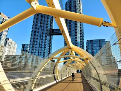 a bridge in a city with tall buildings at TVHR - Luxury Condos in Heart of Downtown with Breakfast in Toronto