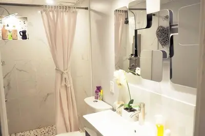 a white bathroom with a sink and a shower at LOVE and Relax at Dream Catcher Retreat in Whitby