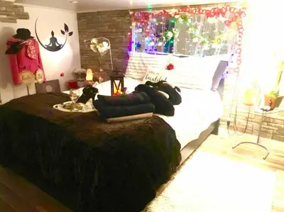 a bedroom with a large bed with pillows on it at LOVE and Relax at Dream Catcher Retreat in Whitby
