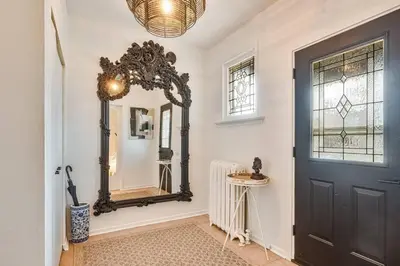 a room with a mirror and a door and a window at Exquisite Luxury Estate - Steps to Downtown in Toronto