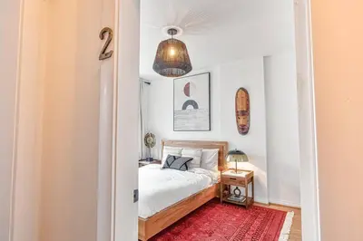 a bedroom with a bed and a red rug at Exquisite Luxury Estate - Steps to Downtown in Toronto