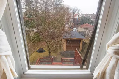 a window with a view of a yard at Exquisite Luxury Estate - Steps to Downtown in Toronto