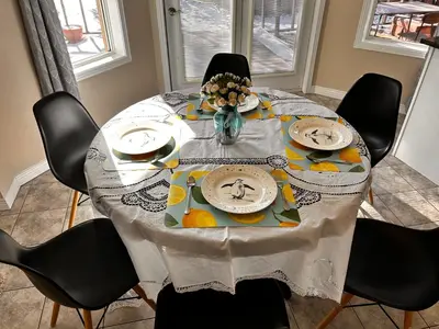 a dining room table with a table cloth on it at \u591a\u4f26\u591a\u6e56\u7554\u522b\u5885\u53cc\u4eba\u95f43 in Bowmanville