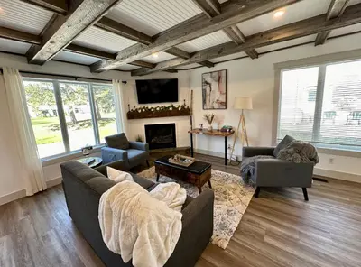 a living room with two couches and a fireplace at Golf Spa Relax in Collingwood