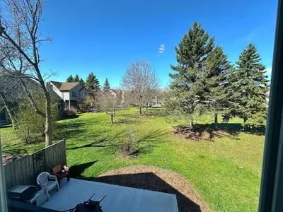 a view of a yard from the porch of a house at Golf Spa Relax in Collingwood