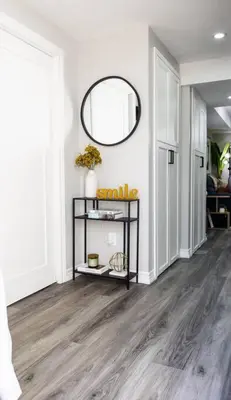 a hallway with a mirror on the wall at French Charm in Brampton 2 Bdrm Apt in Brampton