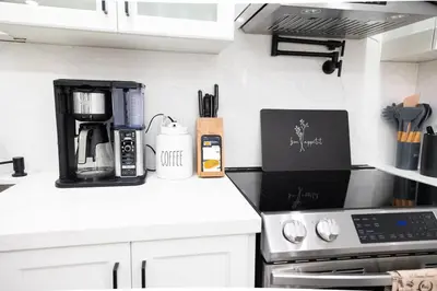 a kitchen counter with a coffee maker on it at French Charm in Brampton 2 Bdrm Apt in Brampton