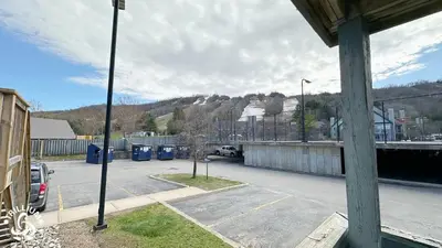 a parking lot with a car parked in a parking lot at Blue Mtn 1 Bedroom with Mountain View in Blue Mountains