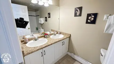 a bathroom with two sinks and a mirror at Blue Mtn 1 Bedroom with Mountain View in Blue Mountains