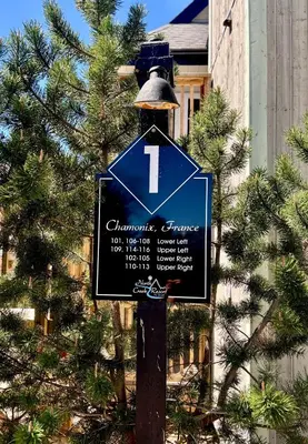 a blue sign on a pole with a light on it at Gorgeous Studio Condo in Blue Mountains Sleeps 4 in Blue Mountains