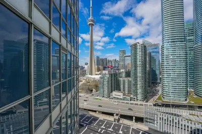 a view of the cn tower from a building at Toronto Views ~ Pool ~ BBQ ~ Harbourfront ~ WIFI in Toronto