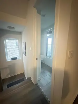 an empty room with a door and a window at Keppel Circle Residence in Brampton