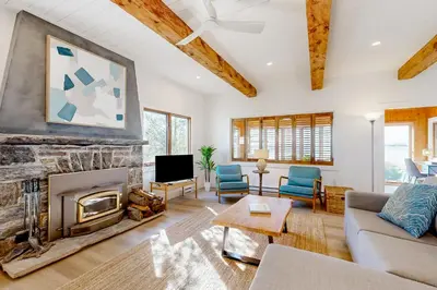 a living room with a fireplace and a tv at 2889 Purvis Street in Innisfil