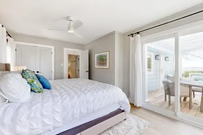 a bedroom with a bed and a sliding glass door at 2889 Purvis Street in Innisfil