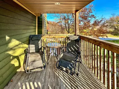 a porch with two chairs and a table on it at 40BKickBack in Collingwood