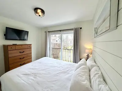a bedroom with a white bed and a window at 40BKickBack in Collingwood