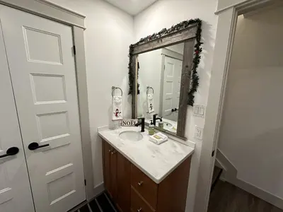 a bathroom with a sink and a mirror at Pony Trail in Collingwood