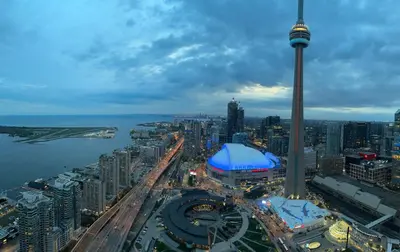 an aerial view of a city with the cn tower at DOWNTOWN, LUXURY CONDO, CN TOWER, ROGERS CENTER, SCOCIA ARENA, UNOBSTRUCTED VIEW in Toronto