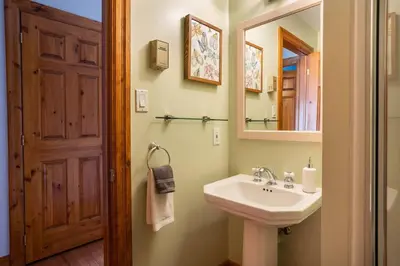 a bathroom with a sink and a mirror at Cosy Chalet - 4 Season Family Oasis in Collingwood
