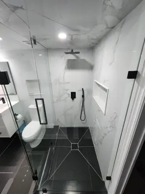 a bathroom with a toilet and a glass wall at Exclusive Home in Niagara Falls in Thorold