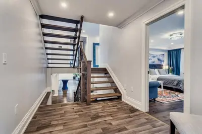 a staircase leading to a bedroom with a bed at Large Estate with Luxury Collection of Amenities in Schomberg