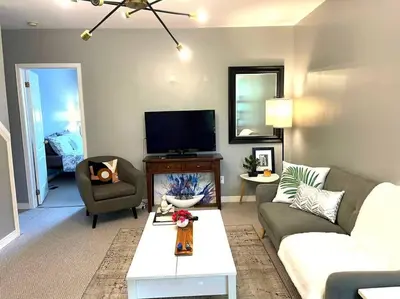 a living room with a couch and a tv at Superb Spacious Loft Old Toronto near Distillery District in Toronto
