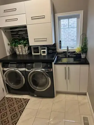 a kitchen with a washing machine and a sink at Stunning House 4 bed 2.5 bath in Kitchener
