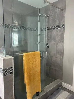 a bathroom with a shower with a yellow towel at Stunning House 4 bed 2.5 bath in Kitchener