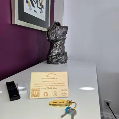 a statue sitting on top of a table with a certificate at The Royal Manor Inn in Niagara on the Lake